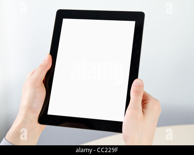 Man hands holding electronic tablet pc with blank screen. Stock Photo