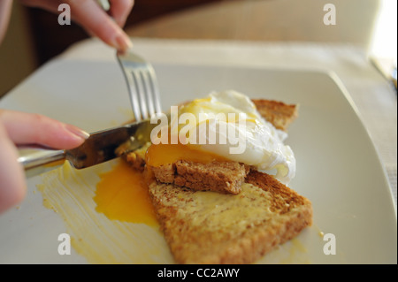 Poached eggs on toast for breakfast Stock Photo