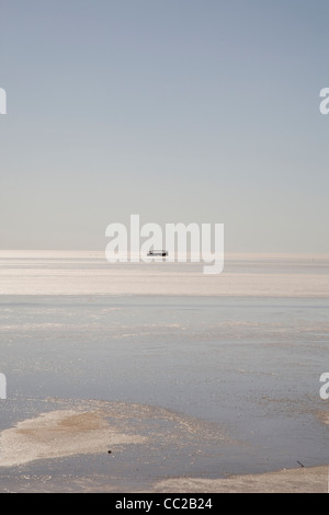 Wrecked bus on the Chott El Jerid, Tunisia. Stock Photo