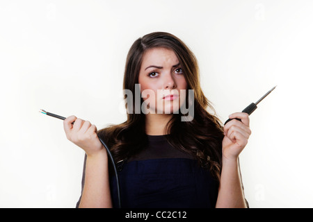 woman doing some electrical wiring Stock Photo
