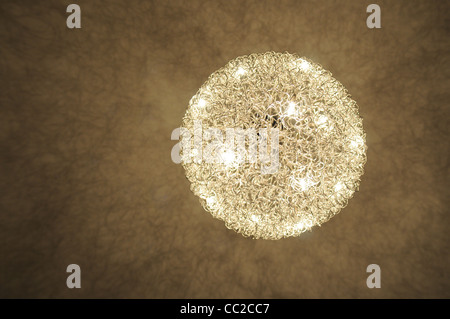 Photograph of a light casting shadows on the ceiling Stock Photo