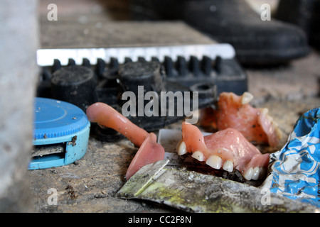 Dentures found on the floor in an abandoned house in Italy Stock Photo