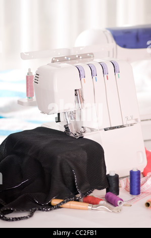 overlock and sewing machine is on the table Stock Photo