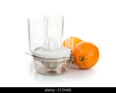 Juicer, ripe oranges and two glasses on white background Stock Photo