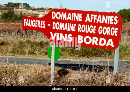 Direction sign to vineyards in Languedoc, France, in the shape of a wine bottle. See CC2HEY for Right pointing sign. Stock Photo