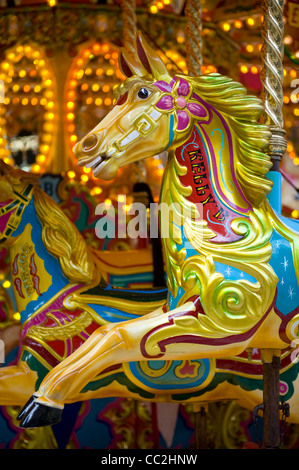 Horse rides on a traditional victorian carousel Stock Photo