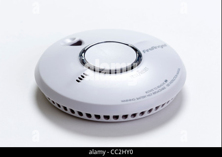a domestic fire / smoke alarm or detector isolated on a white background Stock Photo