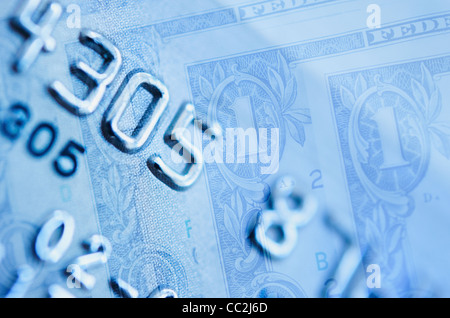 Credit card and dollar bills, studio shot Stock Photo