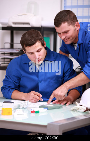 Two laborers in office Stock Photo