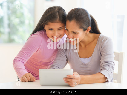 USA, New Jersey, Jersey City, Mother and daughter (10-11) using digital tablet Stock Photo