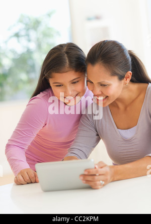USA, New Jersey, Jersey City, Mother and daughter (10-11) using digital tablet Stock Photo