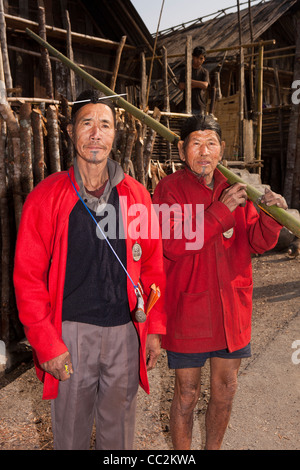 India, Arunachal Pradesh, Ziro Valley, Hong village elders in red coats with tattooed chins Stock Photo