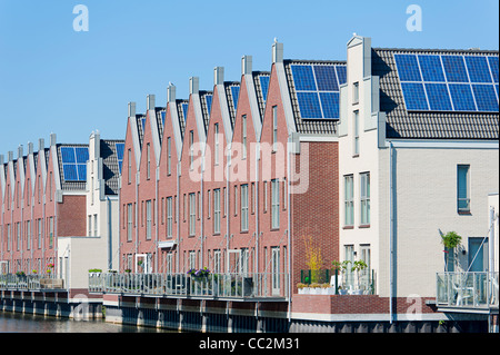 Modern Dutch houses with solar panels on roof Stock Photo