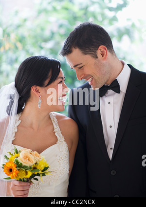 USA, New Jersey, Jersey City, Bride and groom looking at each other Stock Photo