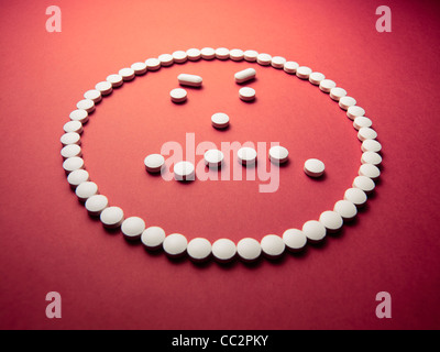 angry face made out of pills and drugs Stock Photo - Alamy