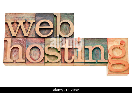 web hosting - internet concept - isolated text in vintage wood letterpress printing blocks, stained by color inks Stock Photo