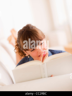 Young woman reading book Stock Photo
