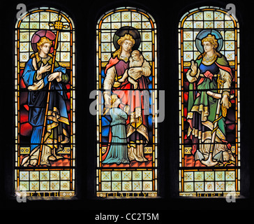 Faith, Charity and Hope window. Church of Saint Andrew, Greystoke, Cumbria, England, United Kingdom, Europe. Stock Photo