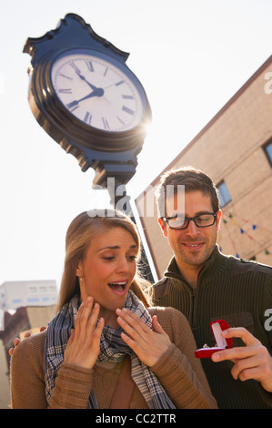 USA, New Jersey, Jersey City, Man proposing to woman on street Stock Photo