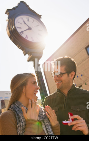 USA, New Jersey, Jersey City, Man proposing to woman on street Stock Photo
