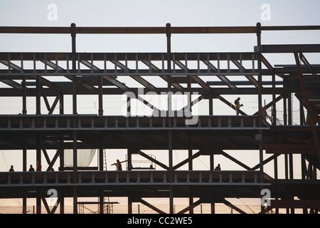 USA, New York City, Group oaf construction workers working on unfinished structure Stock Photo