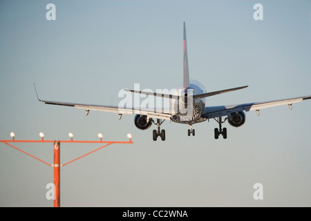 USA, New York City, Commercial aeroplane taking off from runway Stock Photo