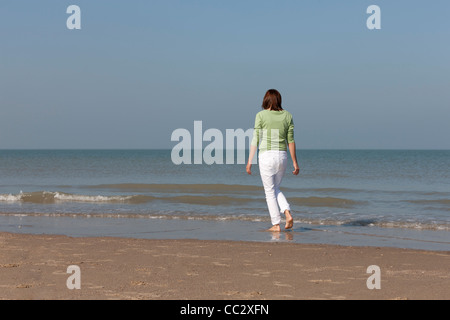 The Netherlands, Domburg, Woman on beach Stock Photo