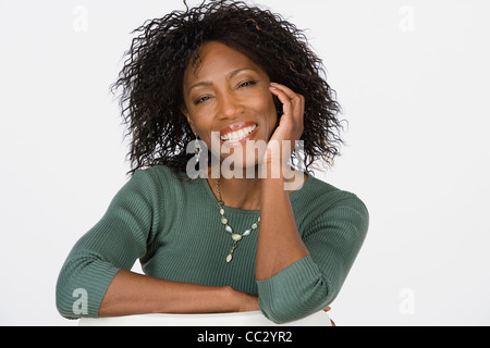 Studio portrait of mature woman Stock Photo