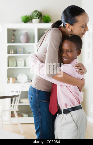 USA, California, Los Angeles, Mother and Son (12-13) hugging Stock Photo