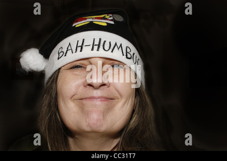 middle-aged woman wearing bah humbug hat