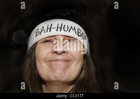 middle-aged woman wearing bah humbug hat