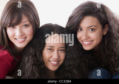 Studio portrait of three young women smiling Stock Photo