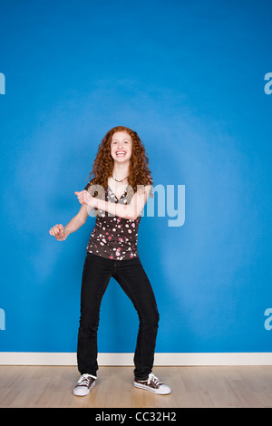 Portrait of teenage girl (16-17) dancing Stock Photo