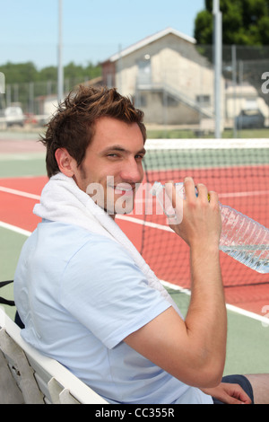 Tennis player on the bench Stock Photo