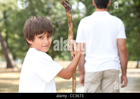 boy and adult in garden Stock Photo