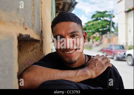 Young smiling man on the street in a small village of Honduras Stock Photo