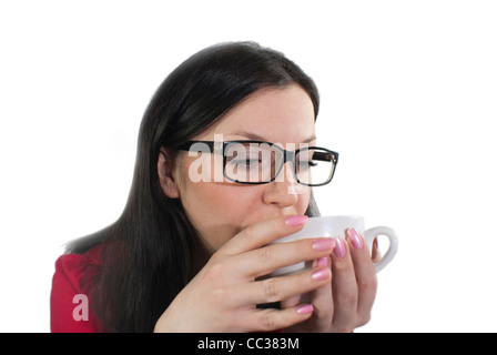 brunette girl with glasses trying to flavored coffee Stock Photo