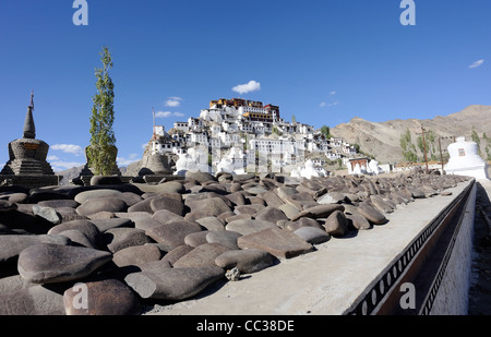 Prayer wall with Thikse Gompa, Monastery, in the background. Tikse, Tiksey,  Thiksey, Thiksay. Thiksey, Ladakh, Stock Photo