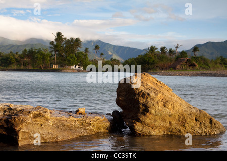 Sunset Rocks on the coast of Luzon in the Philippines Stock Photo