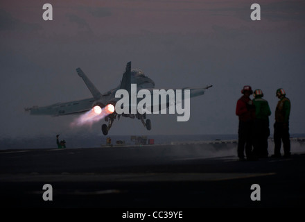 A F/A-18F Super Hornet launches from the flight deck of the Nimitz-class aircraft carrier USS Carl Vinson. Stock Photo