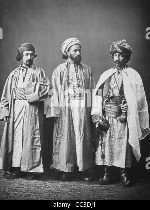 Studio portrait of models wearing traditional clothing from the province of Diarbèkir (Diyarbakır), Ottoman Empire Circa 1873 Stock Photo