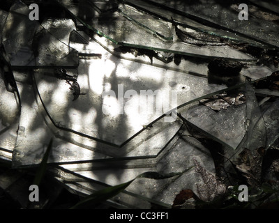 smashed broken glass window panes on floor ground Stock Photo