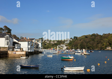 View to waterfront buildings on the quay and moored boats on the Fowey River in Fowey, Cornwall, England, UK, Britain Stock Photo