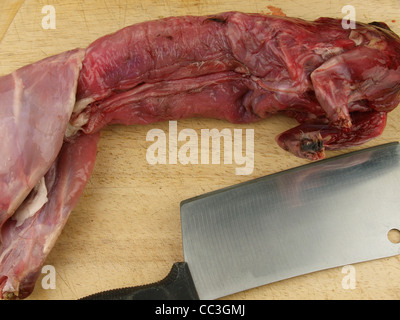 Rabbit on the butchers block, UK Stock Photo