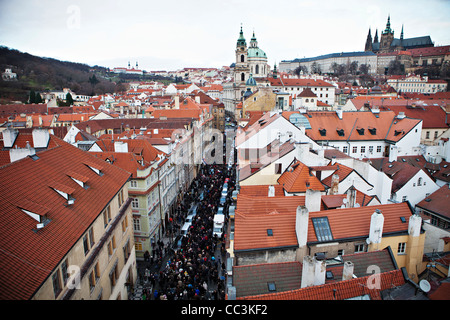 People follow funeral car with remains of Vaclav Havel, the first president of Czech Republic and the last president of Stock Photo