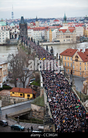 People follow funeral car with remains of Vaclav Havel, the first president of Czech Republic and the last president of Stock Photo