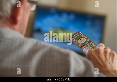 mature male watching daytime television Stock Photo