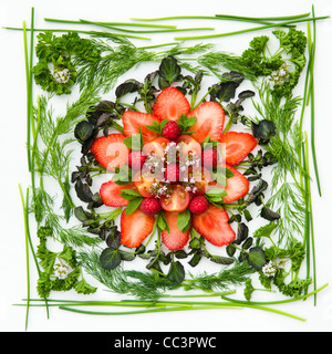 English fruit, herbs and red watercress combined to make a floral platter Stock Photo