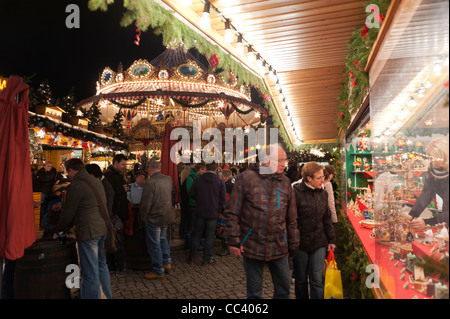 Tourists enjoy the world famous Stietzelmarkt Christmas market in Dresden. Saxony, Germany, Europe Stock Photo
