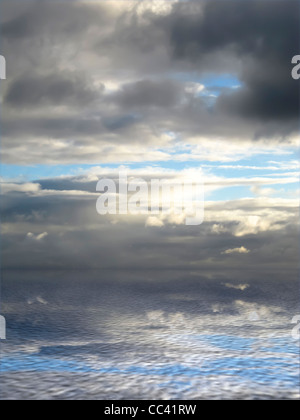 Cloudy sky during sunset with reflections on slightly waves of the sea Stock Photo